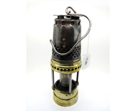 A Brass and Metal Miner's Safety Lamp, with pierced bonnet, fitted with a bulb, 32.5cm high (including suspension hook).