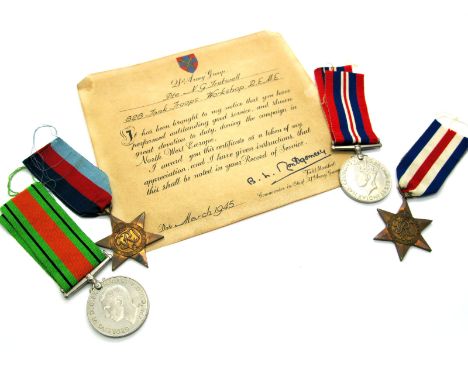 A WWII Medal Quartet, comprising War Medal, Defense Medal, 1939-45 Star and France/Germany Star, to Private George G. Fretwel