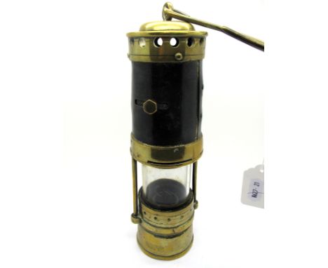 A Brass Miner's Safety Lamp, the metal bonnet with sliding aperture, 33.5cm high (including suspension hook).