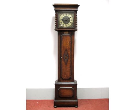 A 1920's Oak Eight-Day Westminster Longcase Clock, with stepped cornice and barley twist supports, silvered dial with Roman n