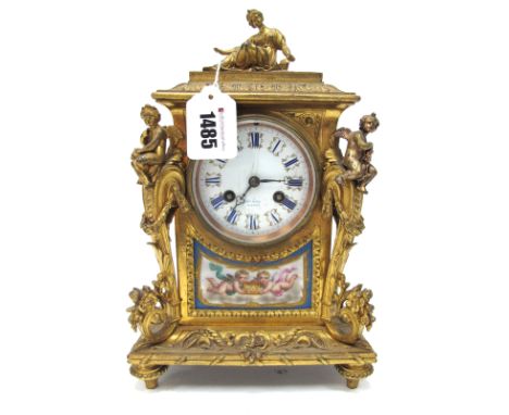 A Late XIX Century French Gilt Metal Clock, the rectangular case inset with Sévres style porcelain panels decorated with cher