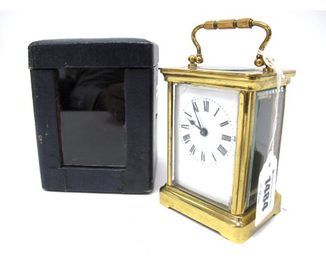 An Early XX Century Brass Cased Carriage Clock, the white enamel dial with Roman numerals, the movement stamped "R and Co. Pa