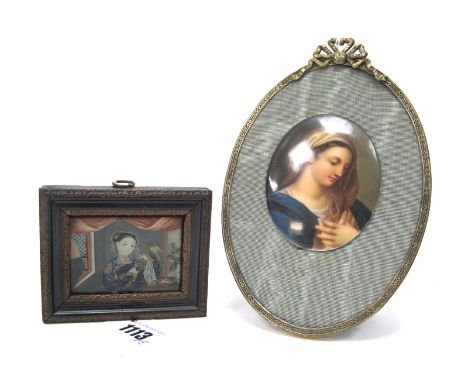 A Berlin Style Late XIX Century Porcelain Oval Plaque, painted with a portrait of a lady, mounted on a later silk and gilt me