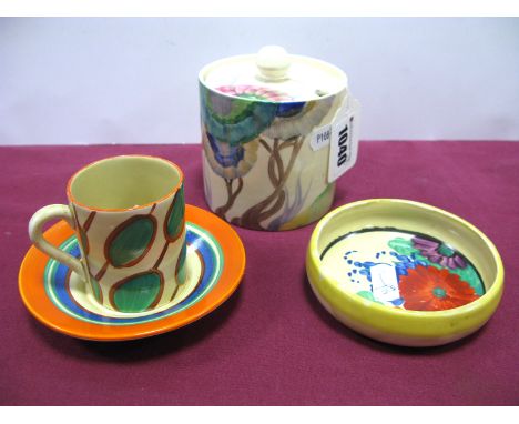 A Wilkinson Ltd Clarice Cliff Fantasque Pottery Coffee Can and Saucer in the 'Umbrella' Pattern, the saucer with orange, gree