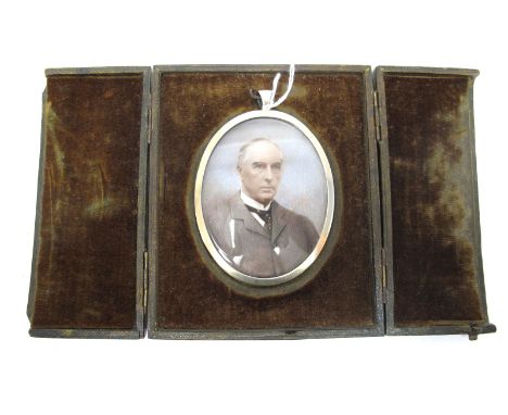 A Late XIX Century Portrait Miniature Painted on Ivory, of a gentleman wearing a white winged shirt, spotted tie and grey jac