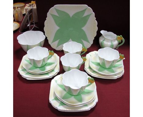 A 1930's Shelley Porcelain Part Tea Service, painted in the 'Apple Green Star' pattern with yellow floral handles, in the dai