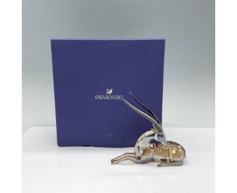 Inspired by the warm colors of Africa, a gazelle in light shades of brown crystal with gold-tone lacquer long horns. This gaz