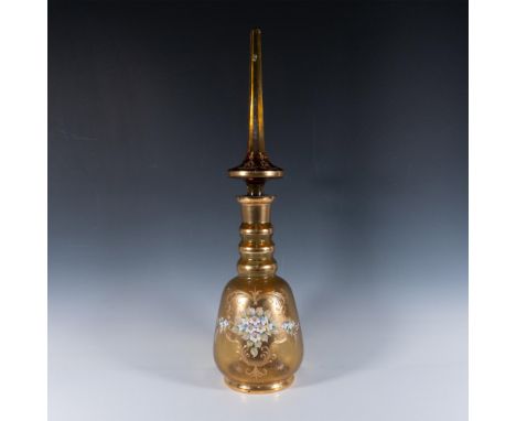 Handcrafted lidded vase featuring intricate gold gilt accents and hand painted floral motifs in high relief. This piece exemp