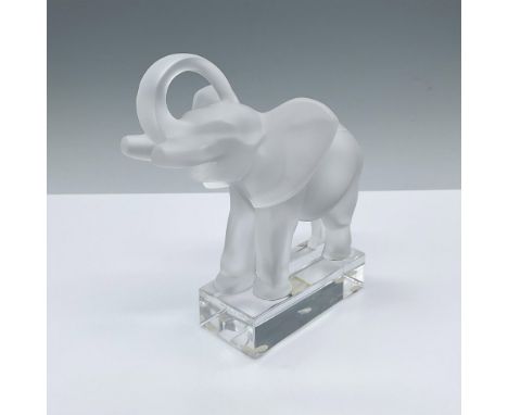 A frosted crystal figure of an elephant with trunk raised up. Attached to a clear crystal base. Lalique France etched on the 