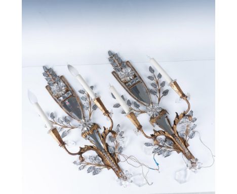 Splendid pair of antique gilded metal, cut crystal two-light sconces. The center part includes two cut-shaped mirrors, each s