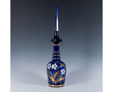 Hand made crystal vase featuring an elongated stopper and a slender, faceted neck. The decanter is adorned with hand painted 