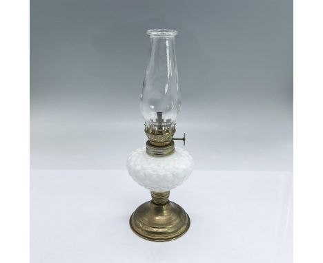 Small lightweight oil lamp with clear glass chimney, white milk glass body, brass colored metal hardware and base. Dimensions