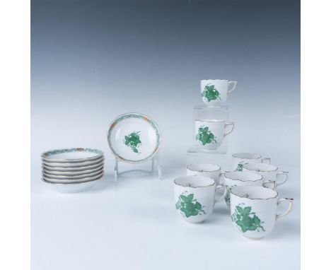 Porcelain Chinese Bouquet Green pattern with gilt accents. Herend backstamps. The saucers measure approximately 4.5"dia. x 0.