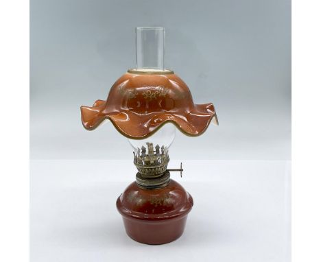 Amber porcelain body and shade oil lamp with clear glass chimney. Dimensions: 8"H x 5" diaCondition: Age related wear.
