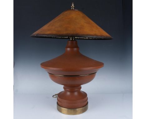 Unique tiered base design in terracotta color, gold toned band and base. Dual light source with twist switch. Faux leather la