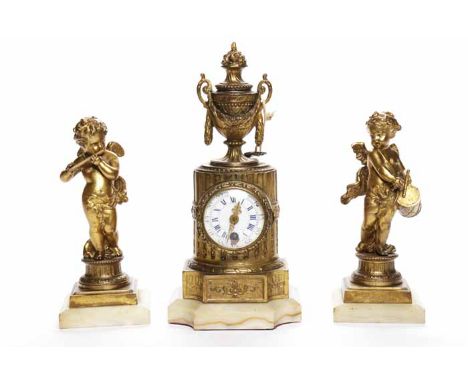 NINETEENTH CENTURY FRENCH ORMOLU CLOCK GARNITURE
the unsigned single train movement with lever platform escapement and number