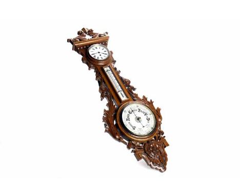 LATE NINETEENTH CENTURY CARVED OAK ANEROID BAROMETER CLOCK
the 8 inch silvered dial signed "A. Swan, Edinburgh", gilt and ste