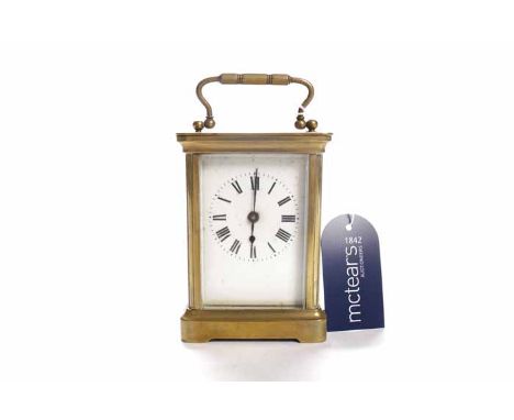 TWENTIETH CENTURY BRASS CARRIAGE CLOCK
the lion stamped single train movement with lever platform escapement, the white ename