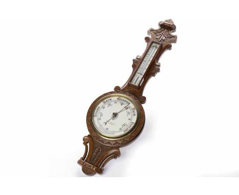 LATE NINETEENTH CENTURY CARVED OAK ANEROID BAROMETER
the 7 inch dial signed "Ayrton & Saunders, Liverpool", gilt and steel ha