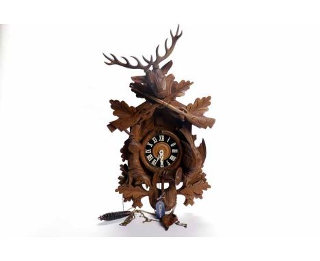 CARVED WOOD STAG'S HEAD BLACK FOREST HUNTING CUCKOO CLOCK
the signed weight driven Regula movement striking on a gong, with a