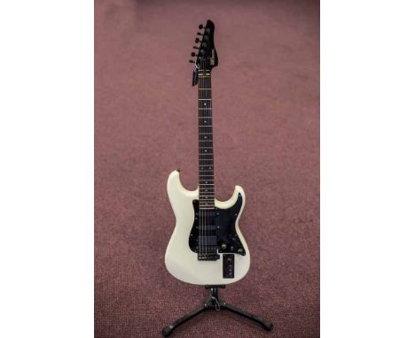 CASIO MIDI MG-510 ELECTRIC GUITAR
serial number T005262, made in Japan, the headstock with ebonised tuning pegs, leading to a