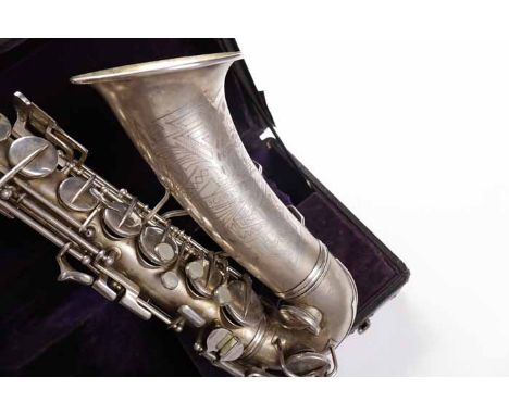 RARE UNDERSLUNG OCTAVE KEY TRANSITIONAL C. G. CONN ALTO SAXOPHONE
circa 1930s, silvered finish, serial number M245648, the se