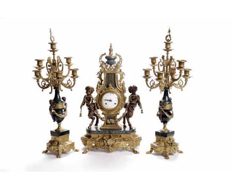 GERMAN ORMOLU CLOCK GARNITURE OF EIGHTEENTH CENTURY DESIGN
by Franz Hermle, Germany, the signed two train movement striking o