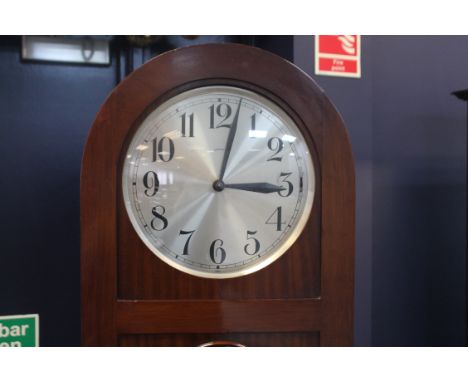 MID-TWENTIETH CENTURY LONGCASE CLOCK 
by Hendersons, the unsigned weight driven movement striking on gongs, the 11 inch silve