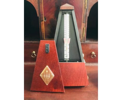 MAHOGANY COLOURED CASED CONTEMPORARY METRONOME BY WITTER, APPROXIMATELY 22cm HIGH 