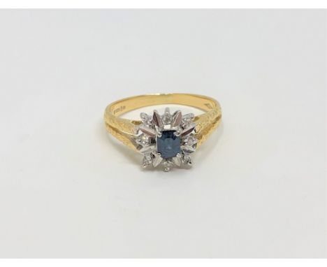 An 18ct gold sapphire and diamond cluster ring, size M CONDITION REPORT: 3.1g