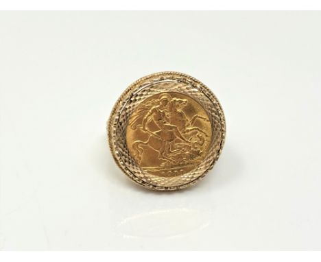 A gent's 9ct gold ring set with a 1911 half sovereign, size T.  CONDITION REPORT: 8g gross. 