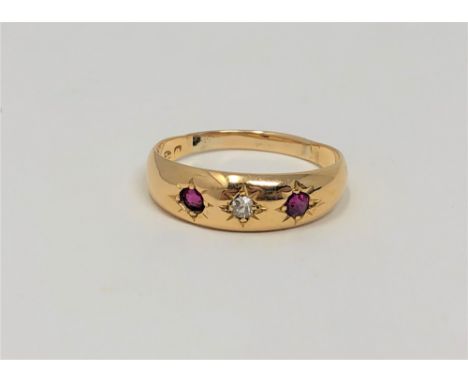 An 18ct gold diamond and garnet ring, size O1/2 CONDITION REPORT: 2.2g