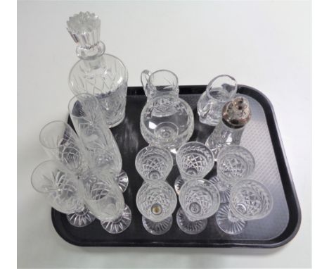 A tray containing cut glass and lead crystal drinking glasses to include Stewart crystal, decanter, jugs, cut glass and silve