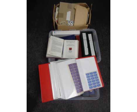 Three boxes containing a large quantity of world stamps and first day covers in albums and folders. 