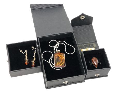 A suite of silver and Baltic amber jewellery by Nova Silver, comprising pendant on chain, pair of spiral drop earrings and a 