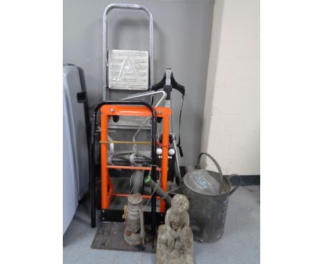 A golf trolley together with a sack barrow, a set of aluminum steps, an aluminium stand off bracket, watering can, oil lamp a