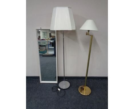 A 20th century white framed hall mirror together with a brass floor lamp with shade and a chrome floor lamp with shade.  