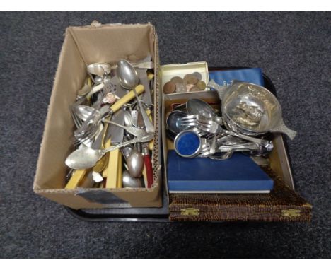 A tray of a quantity of boxed and unboxed stainless steel and plated cutlery together with a plated twin-handled dish, a smal