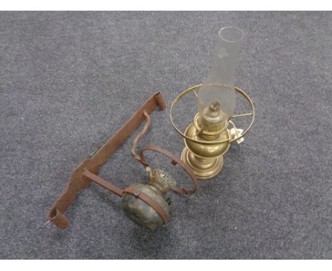 A brass Duplex oil lamp with glass chimney together with an oil lamp with antique cast bracket 