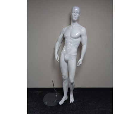 A male shop mannequin on glass stand (white)