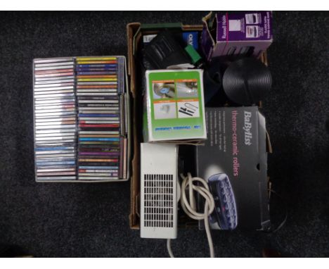 Four storage boxes containing CDs together with a further box containing electricals to include Olympus and Canon camera, car