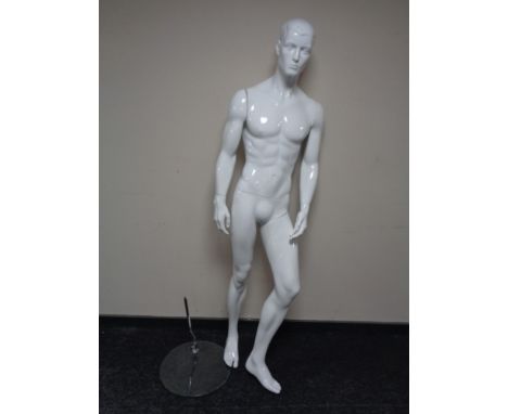 A male shop mannequin on glass stand (white)
