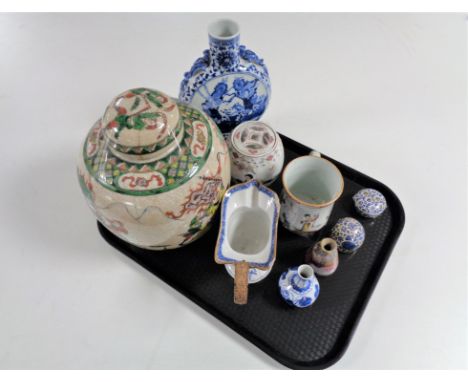 A tray of antique and later Oriental wares, wicker handled blue and white jug (a/f), ginger jar, moon flask vase etc 