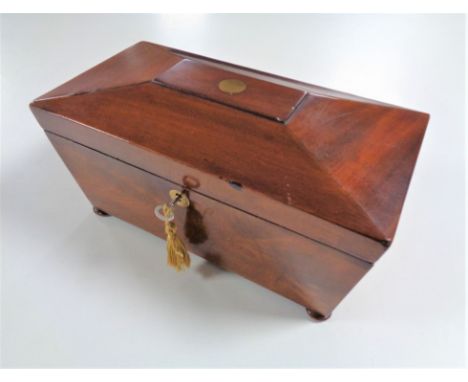 A Georgian mahogany fitted tea caddy with key 