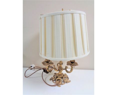 An antique French gilt three-way table lamp with shade. 