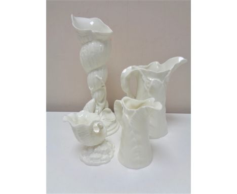 Four pieces of Royal Worcester cream ware bone china, two graduated jugs and two shell vases. 