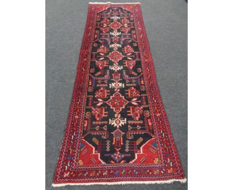 A Hamadan runner, West Iran, 300cm by 100cm