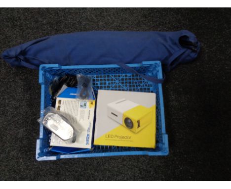 A Next Base dash-cam together with a LED projector and screen in carry bag 
