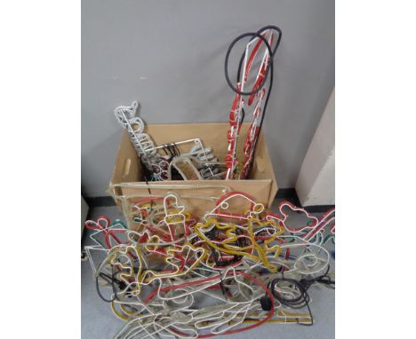 A box containing a large quantity of electric Christmas rope light displays. 