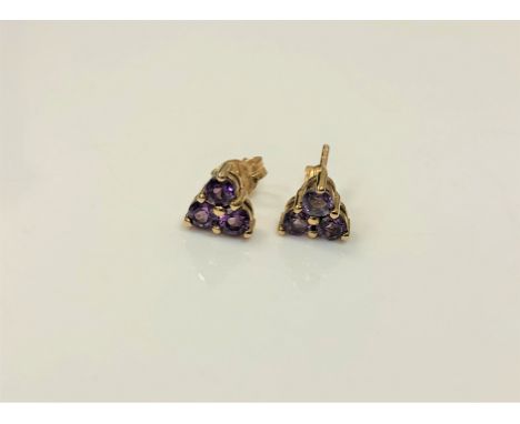 A pair of 9ct gold amethyst cluster earrings.  CONDITION REPORT: 1.2g